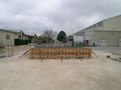 Far away shot of base.  Lab is in background on right;...