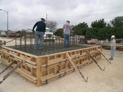 During the pour of the north base.  More vibrating. ...