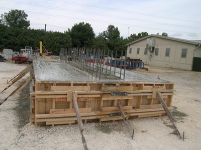 Water seeps to the top of concrete while it dries.