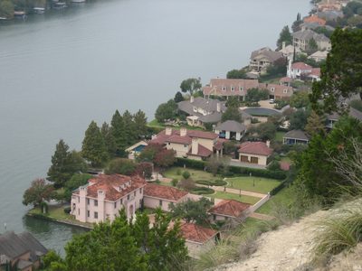 Looking down on some of the houses on the shore, most of...
