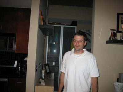Jay wanders through the condo.
