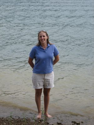Catherine standing on the shore.