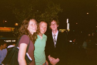 Rachel, John, and Jimmy outside the restaurant.