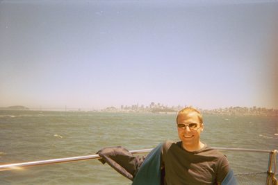 John with the city and the Bay Bridge in the background.