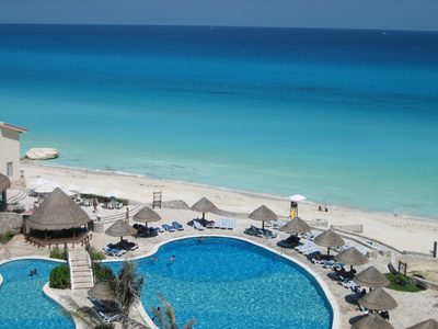 Looking down from the balcony on the pool and beach.