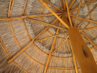A study in how to construct cabana umbrellas from straw.