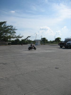 Catherine figures out how to drive the moped in an empty...