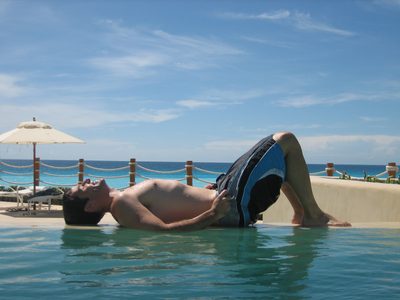 Jay lying on the edge of the infinity pool.