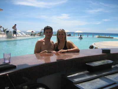 At the bar, with the pool and ocean behind.