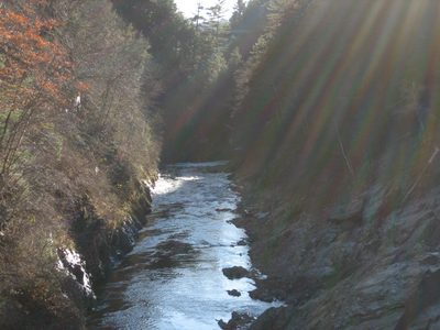 Water and sunlight go down the canyon.