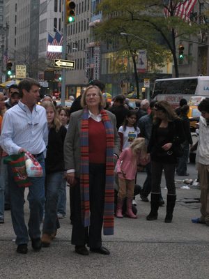 Mom, standing still amongst the hustle and bustle of the city.