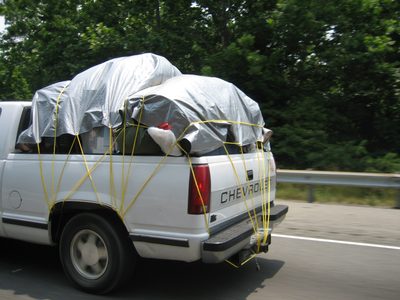 This looks like a banner tie-down-the-tarp job.