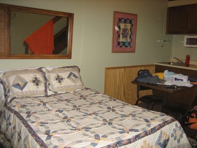 Carrie's bed and the corner of our kitchen.