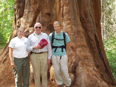 Catherine Dad and John next to a big tree in the Merced...
