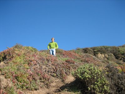 John looking down on Catherine climbing down the path to...