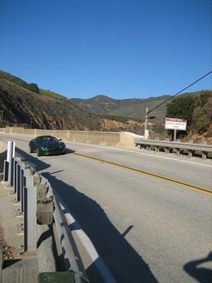 John driving le Lotus across the Bixby Bridge.