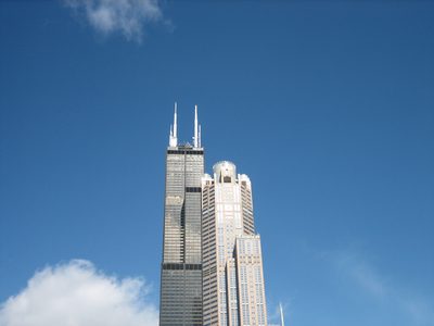 The top of the two tall buildings (311 Wacker is...