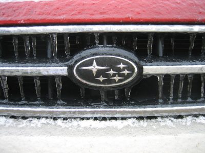 Icicles drip off the front grill of Le Subaru.