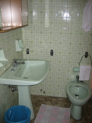 Sink and bidet in the corner of my hostel room.
