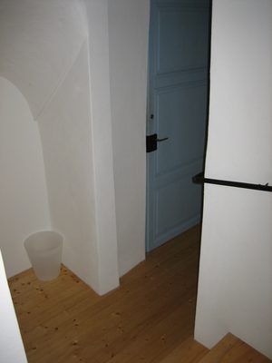Hallway down to the front door and the bathroom.