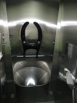 With the craziest toilet contraption I have ever seen...