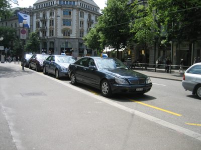 Mercedes taxis line up on the Bahnhofstrasse, the major...
