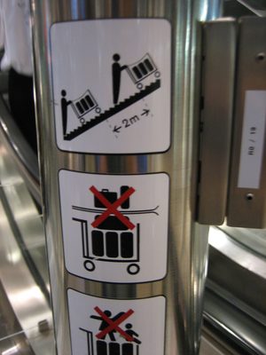 In the airport.  Luggage carts allowed on escalators! ...