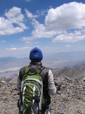 John, looking at the glider from the top of White Mountain Peak.
