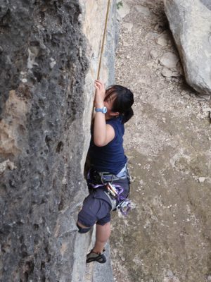 Monica making the first crux move.