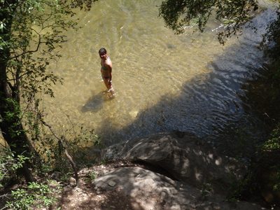 Monica goes swimming after an exhausting climb.