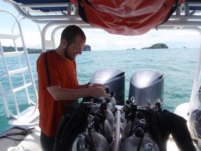 Joel, checking the rigging on his air tank before our first dive.