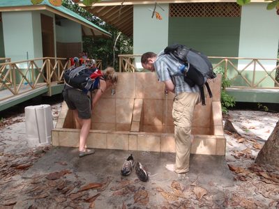 Joel and Morgan wash their feet in a conveniently placed...
