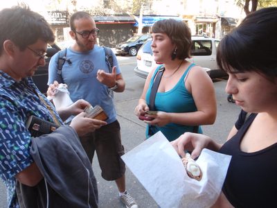 Eating cannolis on the street. 