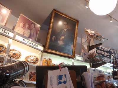 Portrait of Joel Russ, founder of the store hanging...