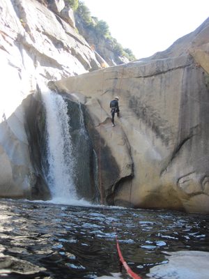 Colin rappels down a 30-foot jump.