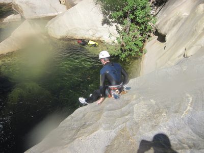 Colin sliding into a pool. See that triangle shaped rock...