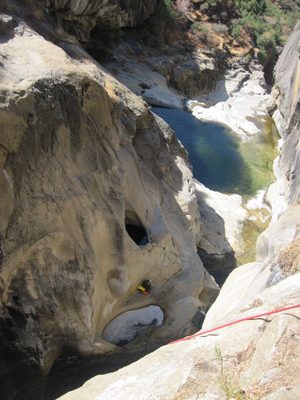 Joel waits below while we use a rope to get down the Big...