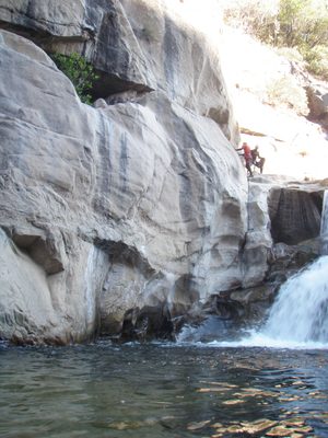 John climbs to the ledge first.