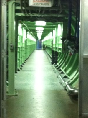 Long hallway connecting the control room from the...