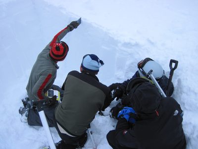 Richard shows how to use a plastic card to measure snow...