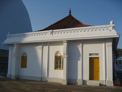 The whitewashed exterior and colorful doors and windows...