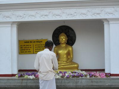 An older pious Buddhist Sri Lankan.