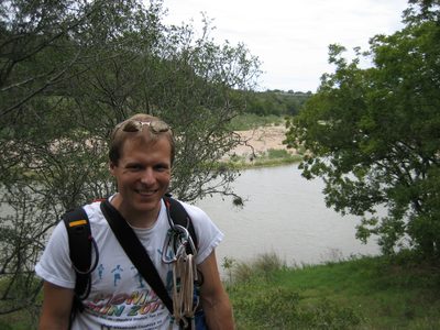 John in front of the Pedernales - the river that runs...