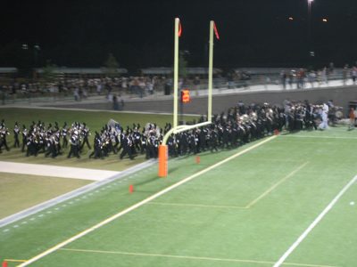 The band coming down to get ready for halftime.