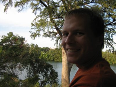John on the train, with Town Lake in the background.