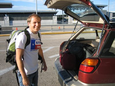 John at the airport, getting his stuff out of the back...