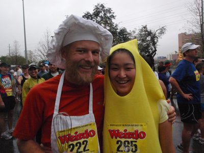 One chef and one banana.  Waiting at the starting line.