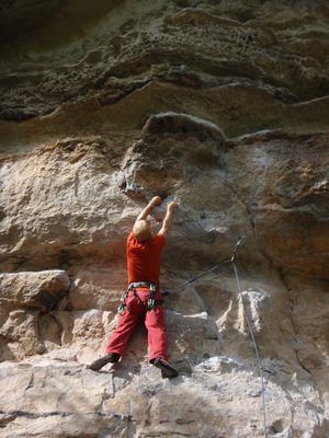 John, working on a 5.10d climb in the Barton Springs...