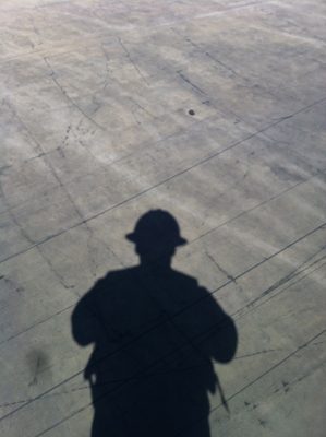 John's helmet casting a shadow.