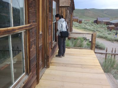 Monica checking out an "arrested decay" house. Guess it...